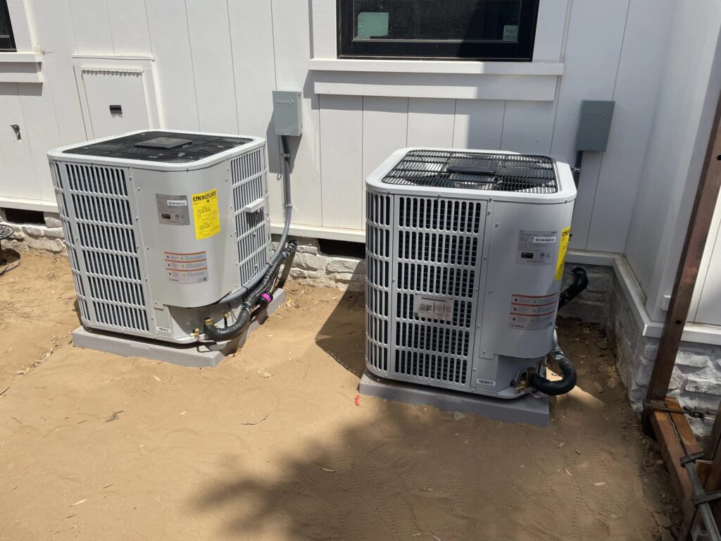 Two newly installed residential air conditioning condenser units